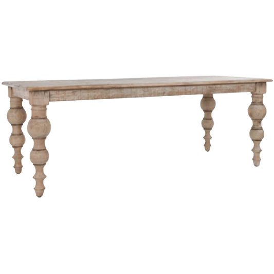 Rectangular dining table with elegantly turned legs, featuring a neutral finish and a distinctive textured surface for a timeless look.
