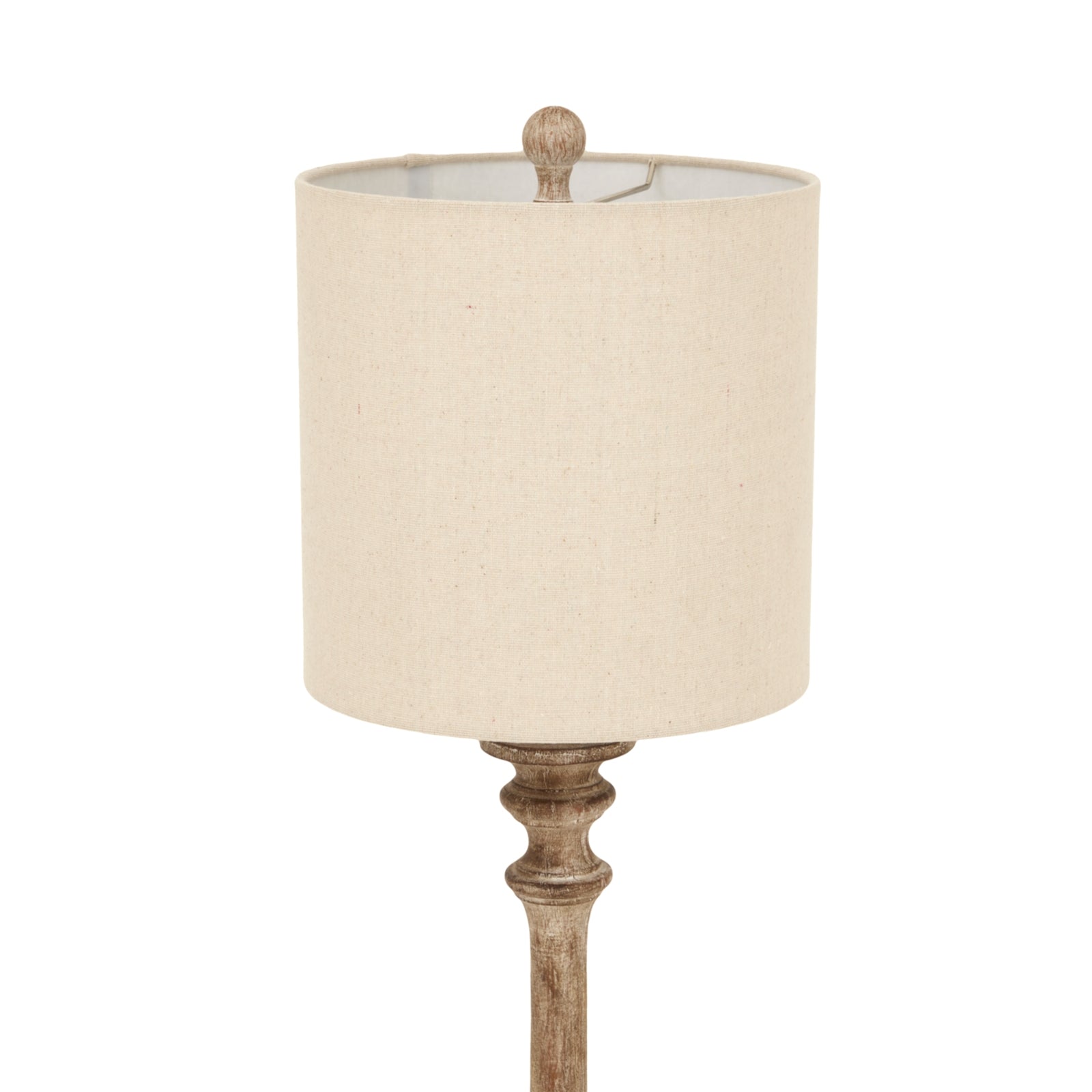 Pallido candlestick table lamp featuring a textured linen shade and intricately detailed metal base in a muted finish.