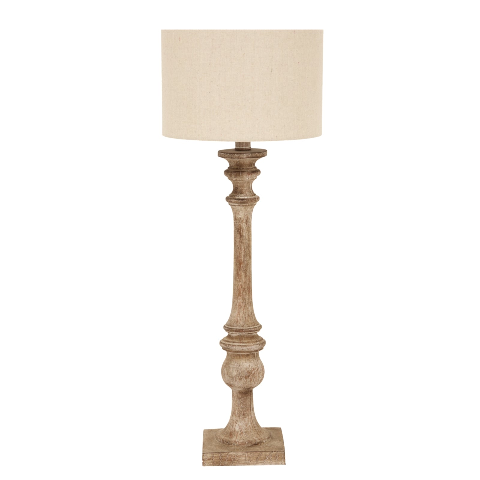 Elegant candlestick table lamp with a pallido finish and a cylindrical linen shade, perfect for adding warmth and style.