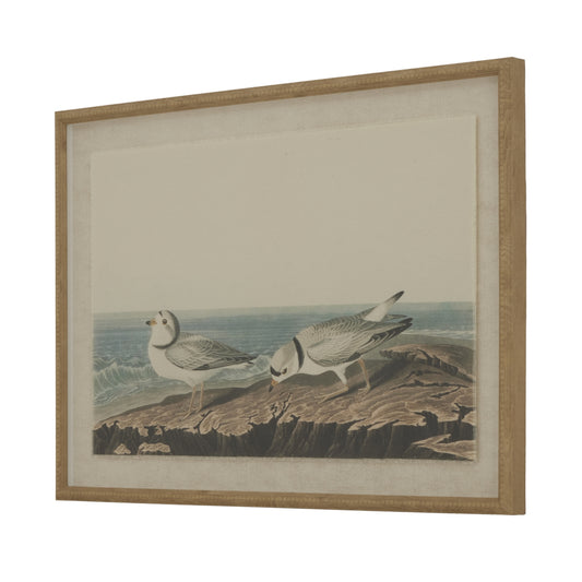 Framed artwork of plovers on natural linen, set against a coastal background, featuring intricate beaded detailing.