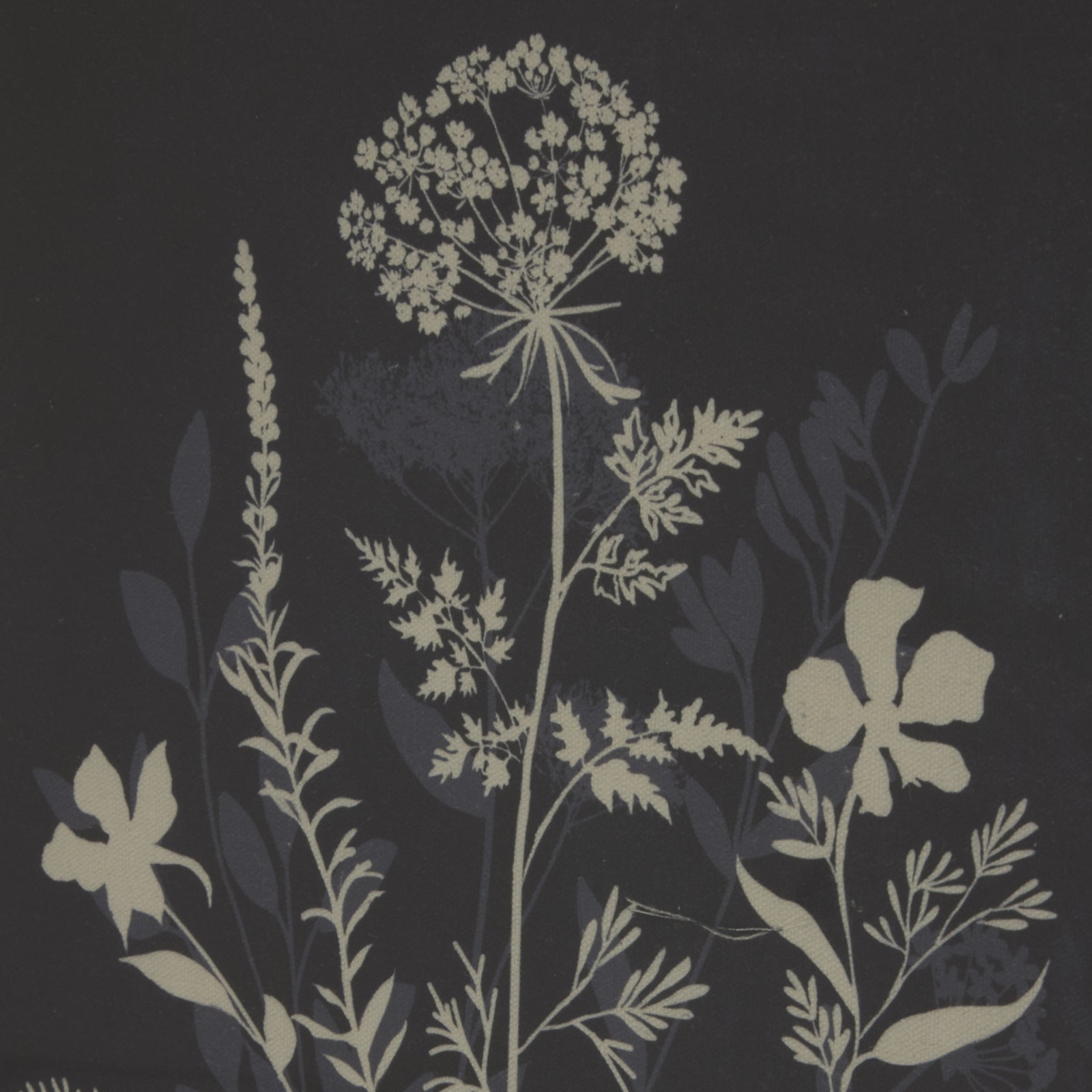 Meadow scene in soft cream on dark linen, bordered by an elegant beaded frame, offering natural charm and serenity.