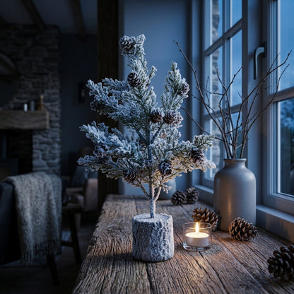 Small Snowy Fir Tree With Pinecones In Wood Log